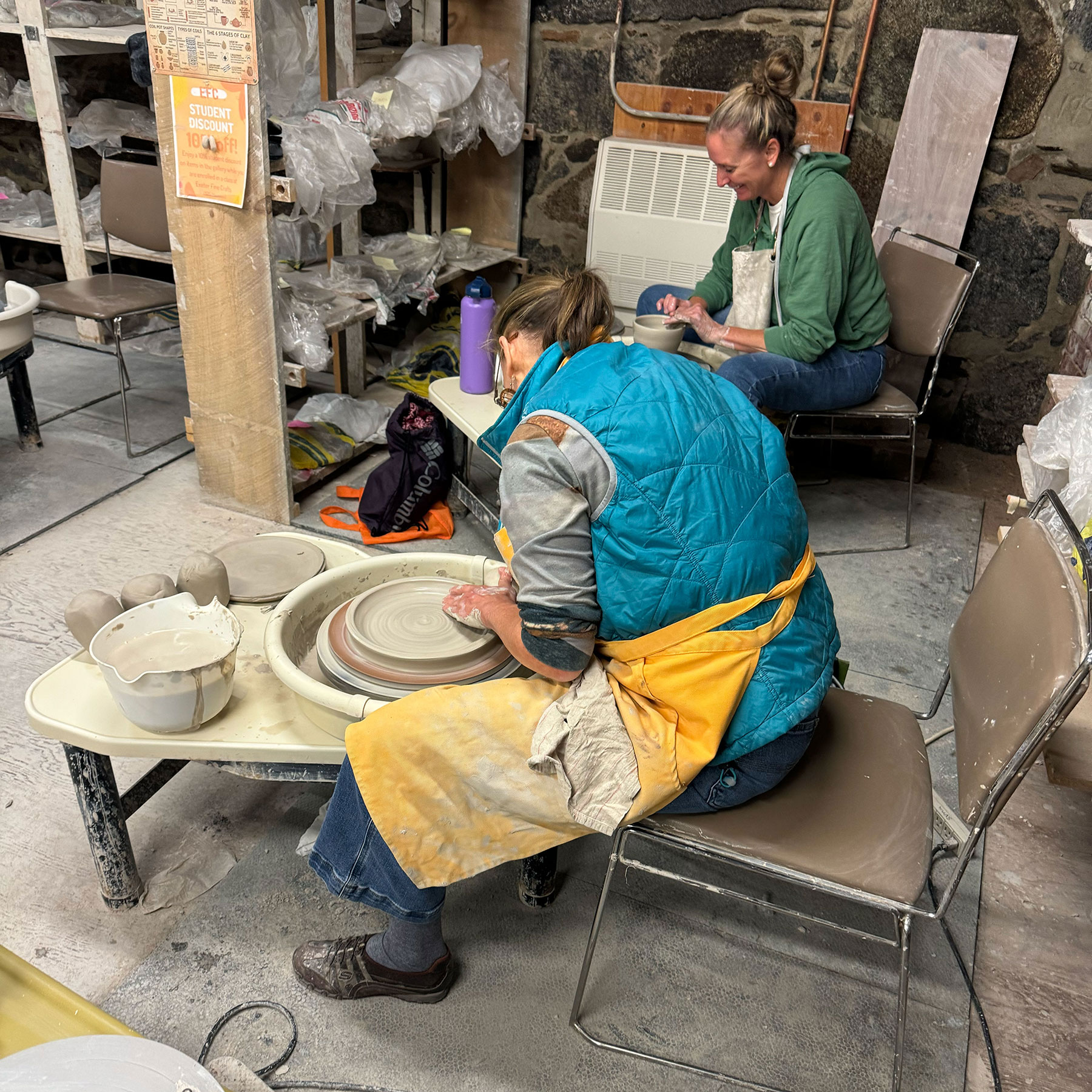 EFC Pottery Students at Wheel